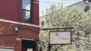 A vintage car parked in front of a building with a sign reading 'La Bohème.' - Charming Hoboken location. Fast Path, Bus or Ferry to NYC.  High End Furniture.  (Hoboken)