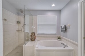 Bathtub, hair dryer, towels, soap