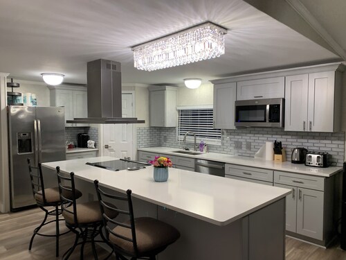 Cozy 5 Bedroom 85” TV Home in a Secluded Area