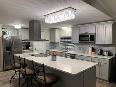 Cozy 5 Bedroom 85” TV Home in a Secluded Area