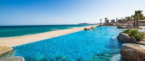 On the beach, sun loungers, beach towels