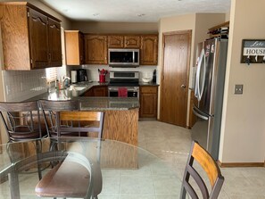 Kitchen with Stainless Steel Appliances  - Cozy Lake Home in Hawaiian Village (Papillion)