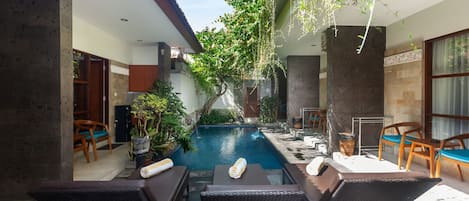 Outdoor pool, open 6:00 AM to 10:00 PM, pool umbrellas, pool loungers