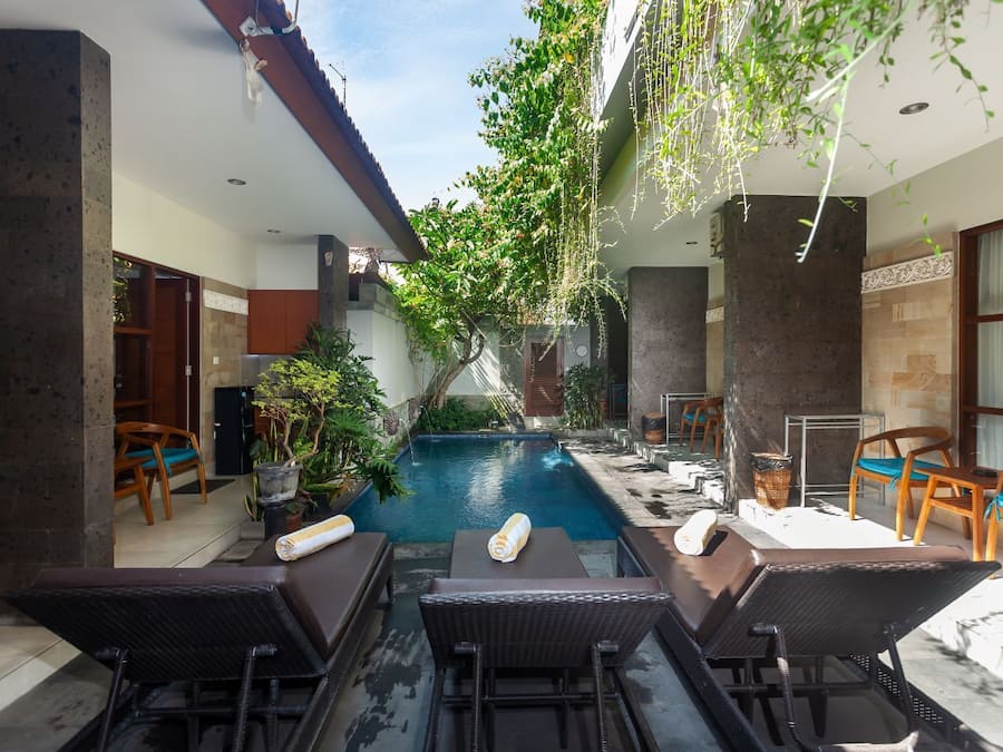 Outdoor pool, open 6:00 AM to 10:00 PM, pool umbrellas, pool loungers