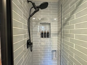 Combined shower/bathtub, hair dryer, towels, soap