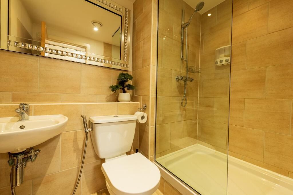 Deluxe appartement | Badkamer | Milieuvriendelijke toiletartikelen, handdoeken, zeep, shampoo