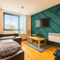 Deluxe Apartment | Living area | 32-inch flat-screen TV with digital channels, TV