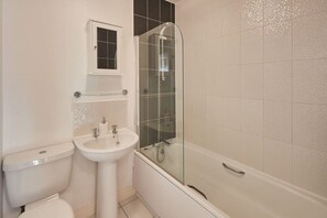 Bathtub, hair dryer, towels, soap