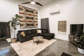 Open living room, couch folds out to full-size bed 🛌 