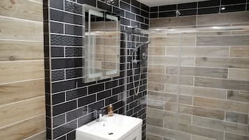Bathtub, hair dryer, towels, soap