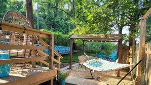 A wooden deck with a hammock, a pergola, and outdoor seating. - Tremont! 7 min to downtown Cle (Cleveland)