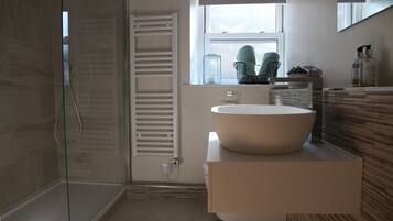 Shower, hair dryer, towels, toilet paper
