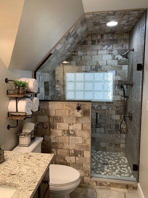 Shower, hair dryer, towels, soap