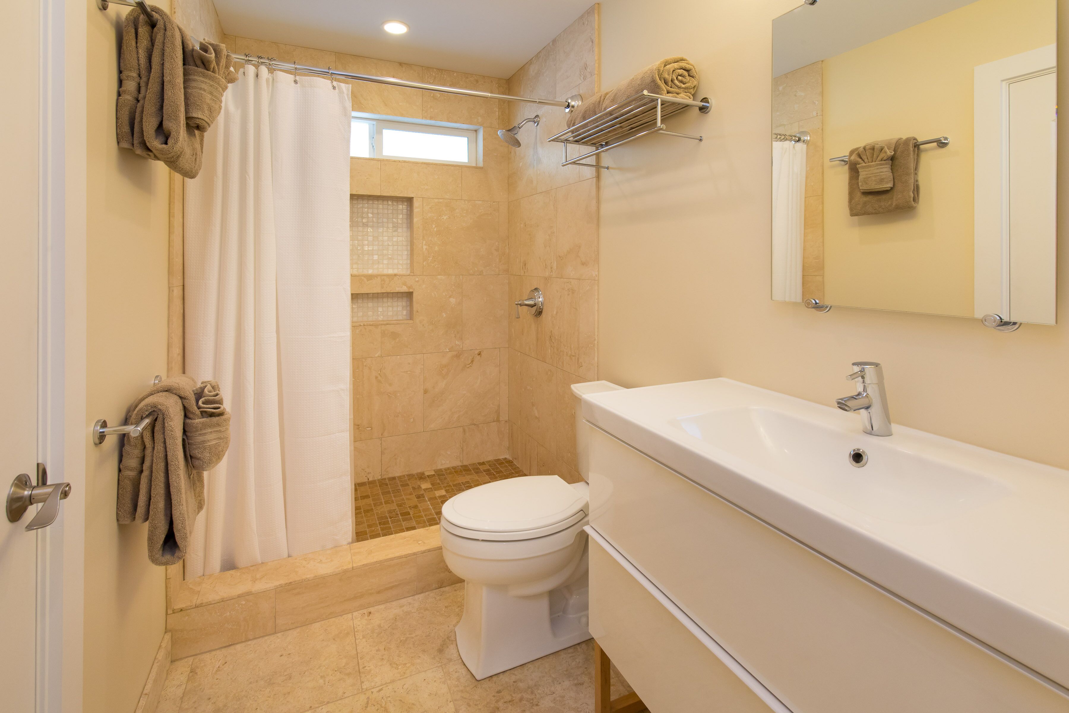 Combined shower/tub, hair dryer, towels, soap