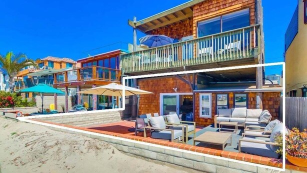 A multi-story beachfront property with a balcony, outdoor seating area, and a pool. - Ocean Front! Exclusive Beachfront Patio + A/C (San Diego)