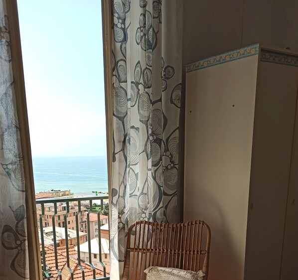 Relax on the balcony with a wicker chair and enjoy the view of the surrounding residential area.