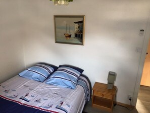 2 dormitorios, tabla de planchar con plancha, cuna de viaje y wifi