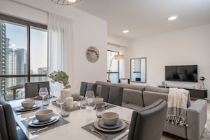 Enjoy meals in the dining area, relax in the seating area, and unwind with a city view.