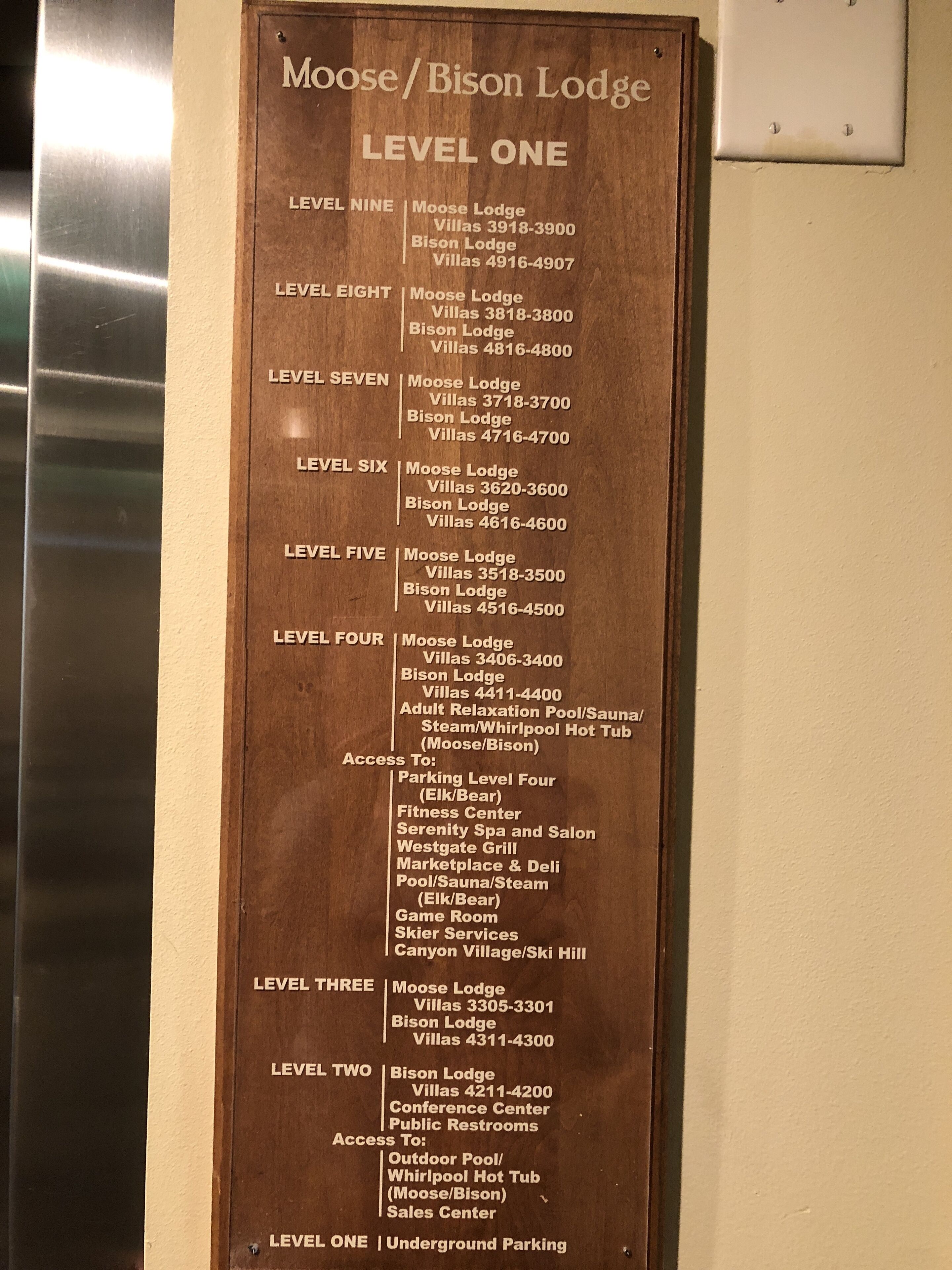 A directory sign for Moose/Bison Lodge with levels and amenities listed.