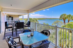 Outdoor dining - Captain's Cove waterfront condo with shared heated pool (Indian Shores)