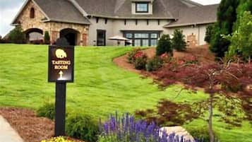 Explore the rooftop lookout and stroll through the beautifully landscaped garden, featuring a variety of flowering plants.