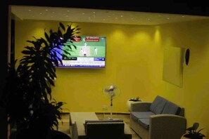 Apartment | Living area | 30-inch TV with digital channels
