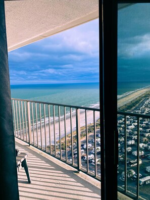 A balcony with a view of the beach and ocean. - Family Friendly Oceanfront Resort/Heated Indoor & Outdoor Pools/Bar and Grill. (Myrtle Beach)