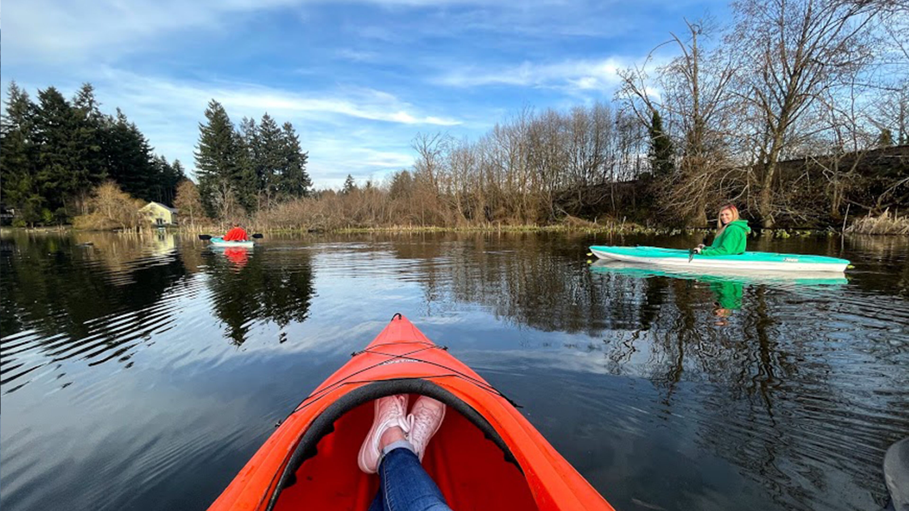 A calm river with kayaks.