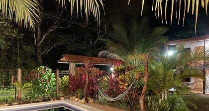 A rustic lodge surrounded by gardens, in a jungle setting - double Room 1