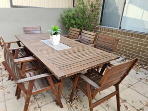 Access to outdoor seating and BBQ area in the back yard.