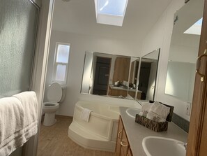 Combined shower/bathtub, hair dryer, bathrobes, towels