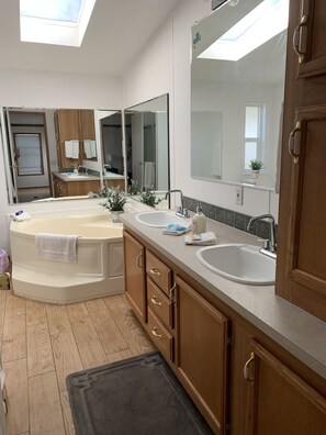 Combined shower/bathtub, hair dryer, bathrobes, towels