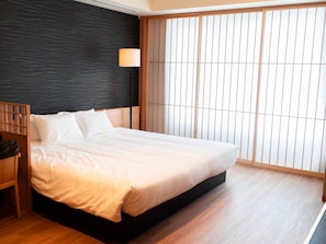 Habitación cuádruple junior, para no fumadores (Suite) | Ropa de cama de alta calidad y edredón