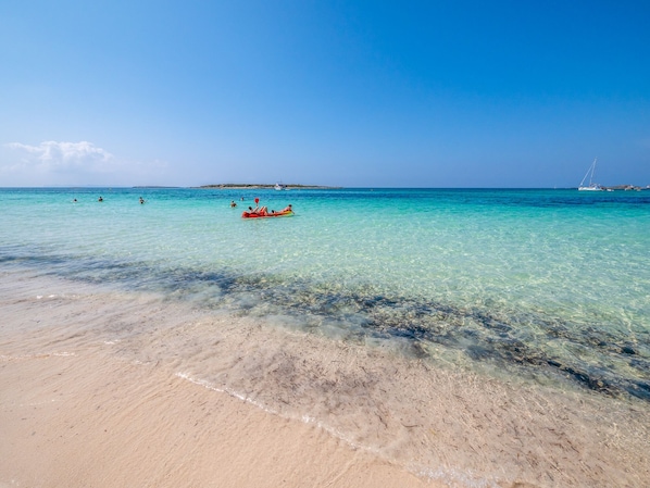 On the beach, sun loungers, beach towels