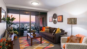 Deluxe Apartment, 2 Bedrooms, Balcony, River View | Living room | 45-inch Smart TV with digital channels, TV, Netflix