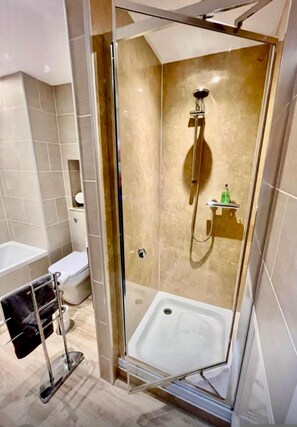 Separate tub and shower, deep soaking tub, hair dryer, towels