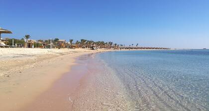 Breathtaking penthouse view of golf, rocky desert and Red Sea