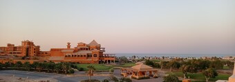 Breathtaking penthouse view of golf, rocky desert and Red Sea