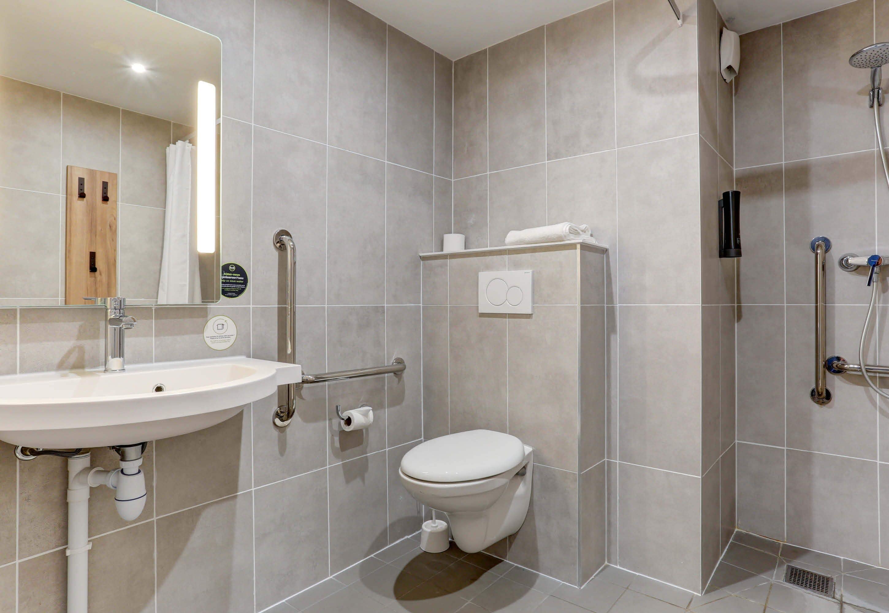 double room, mobility accessible | bathroom | shower, towels, soap, shampoo