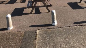 A brick building with a sign reading "Dutchy's Tavern" and multiple picnic tables arranged in the foreground. - 2 bed dog Friendly Chalet on Sunbeach Scratby (Great Yarmouth)