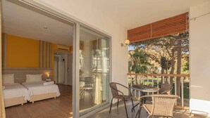 A hotel room with a balcony, a bed, a table, and chairs. - Ladonia Hotels Mio Bianco  (Bodrum)