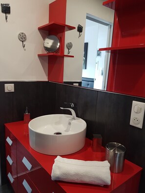 Shower, hair dryer, soap, toilet paper