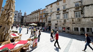 A bustling square with outdoor seating and historic buildings. - Luxury apt With Roofed Patio Near Beach & Center (Split)