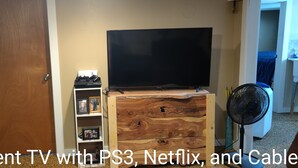 A basement TV with PS3, Netflix, and cable.