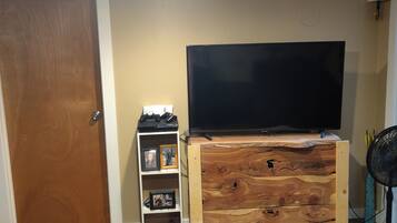 A basement TV with PS3, Netflix, and cable.