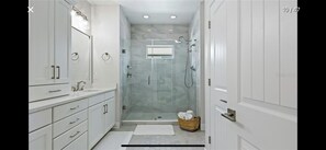 Combined shower/tub, hair dryer, towels, soap