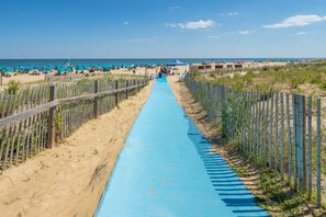 On the beach, sun-loungers