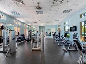 A gym with cardio machines, weight stations, and dumbbells. - Newly remodeled coach home & golf membership in Vasari Country Club. (Bonita Springs)