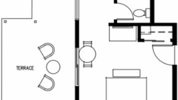 Een plattegrond met een terras, een keuken, een badkamer en een slaapkamer.