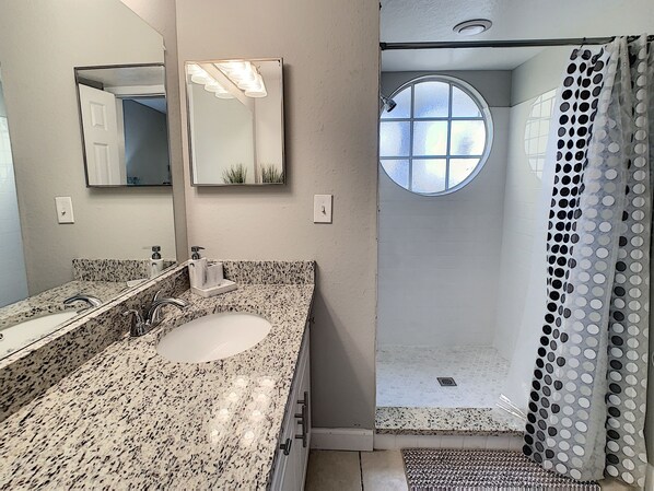 Bathtub, hair dryer, towels, soap